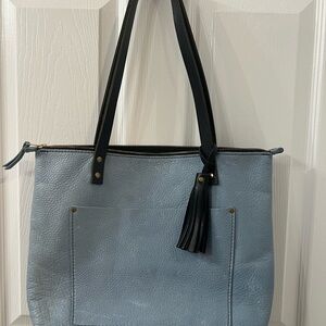 Portland leather dreamy blue medium zipper tote with tassel.